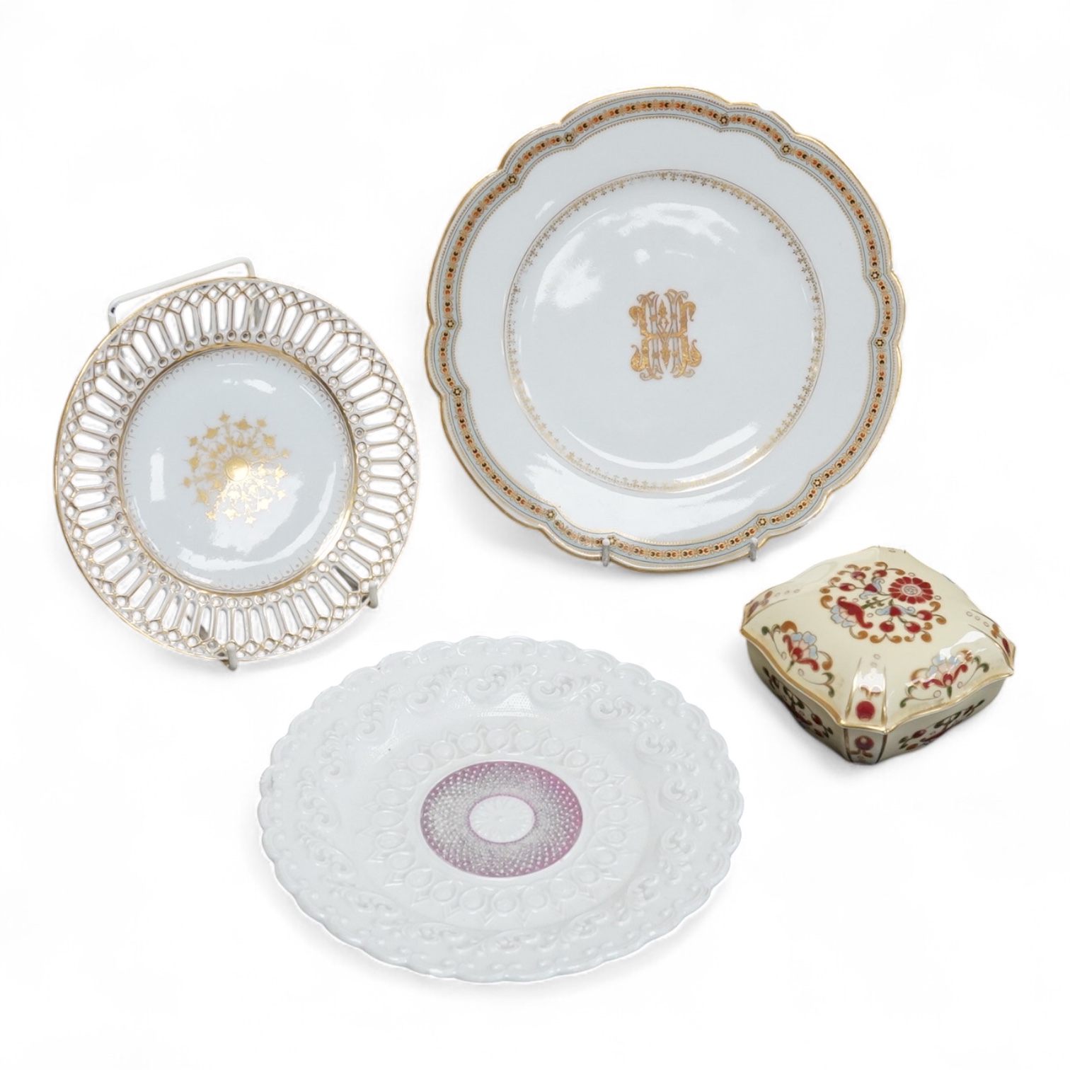 A Meissen plate, a Zsolnay box and cover, and two continental plates, largest 24cm in diameter